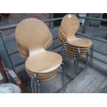 12 stackable laminated metal framed chairs.