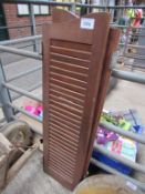 Pair of wooden louvred shutters. Height 125cms.