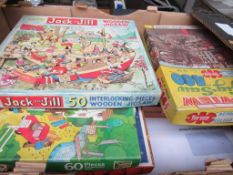 2 boxes of jigsaw puzzles.