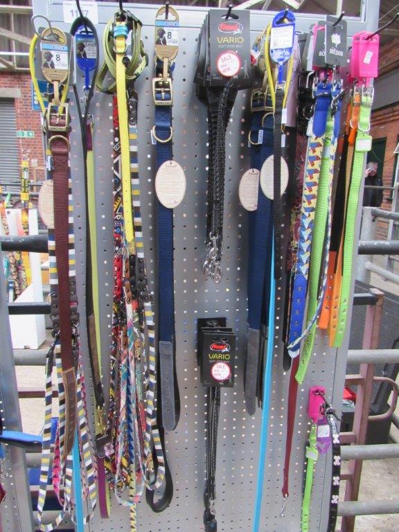 Quantity of dog leads together with display stand.