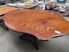 Ornate inlaid dining table.