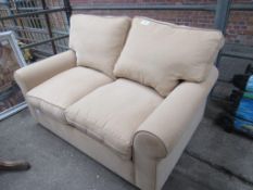 Light brown upholstered 2 seat sofa/ sofa bed.
