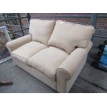 Light brown upholstered 2 seat sofa/ sofa bed.