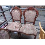 2 upholstered spoon-back chairs.