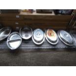 6 large stainless-steel serving dishes with lids.