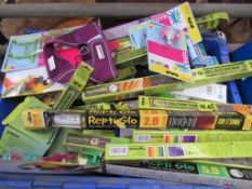 3 boxes of assorted pet accessories including reptile sun strip tubes.