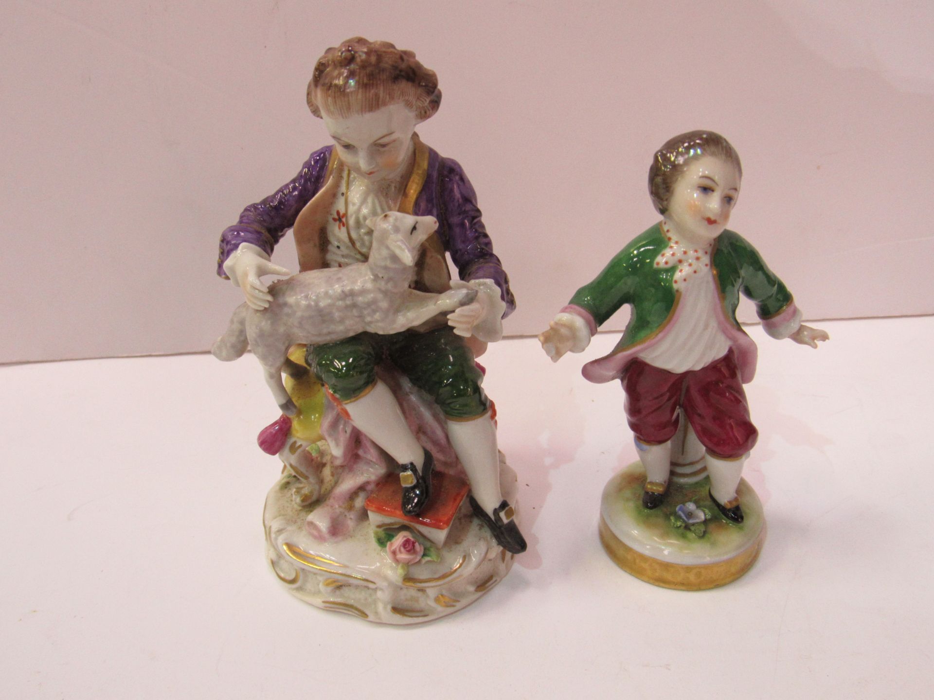 Sitzendorf porcelain boy with lamb figurine together with a Naples porcelain small boy figurine