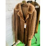 Astrakhan beige long coat.