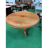 Mahogany circular tilt top table.