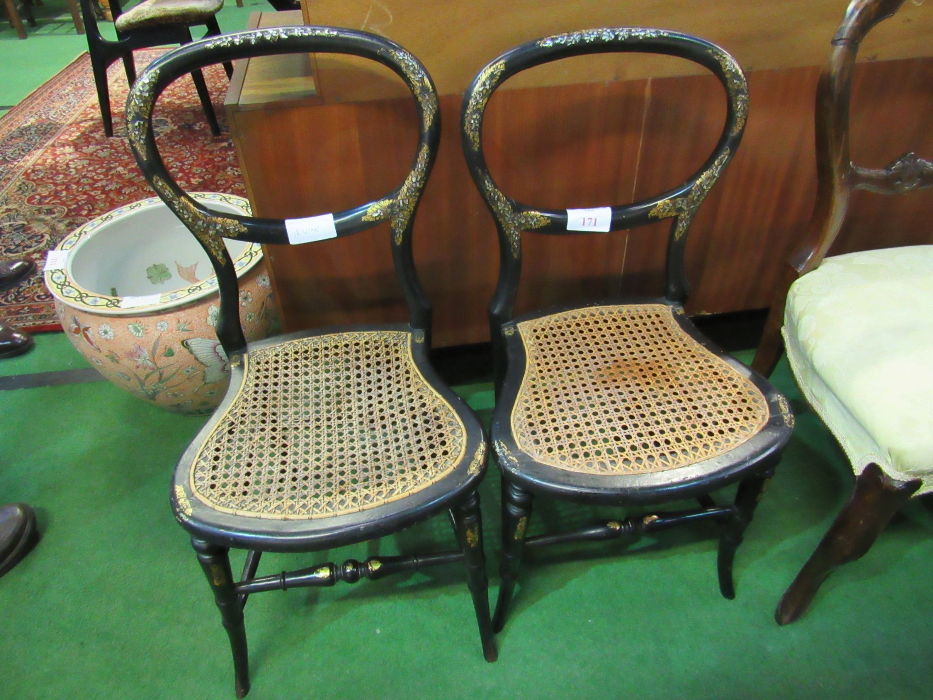 2 ebonised and mother of pearl decorated cane seat bedroom chairs.