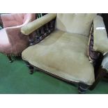 Victorian / Edwardian brown upholstered armchair on casters.