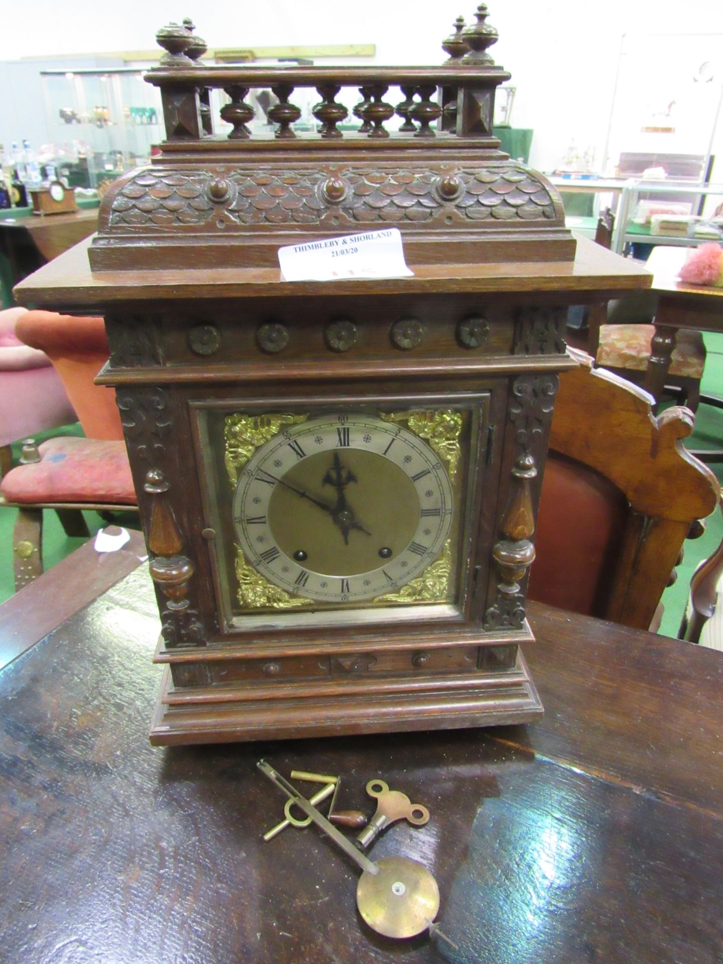 Oak cased mantel clock by W&H Son.