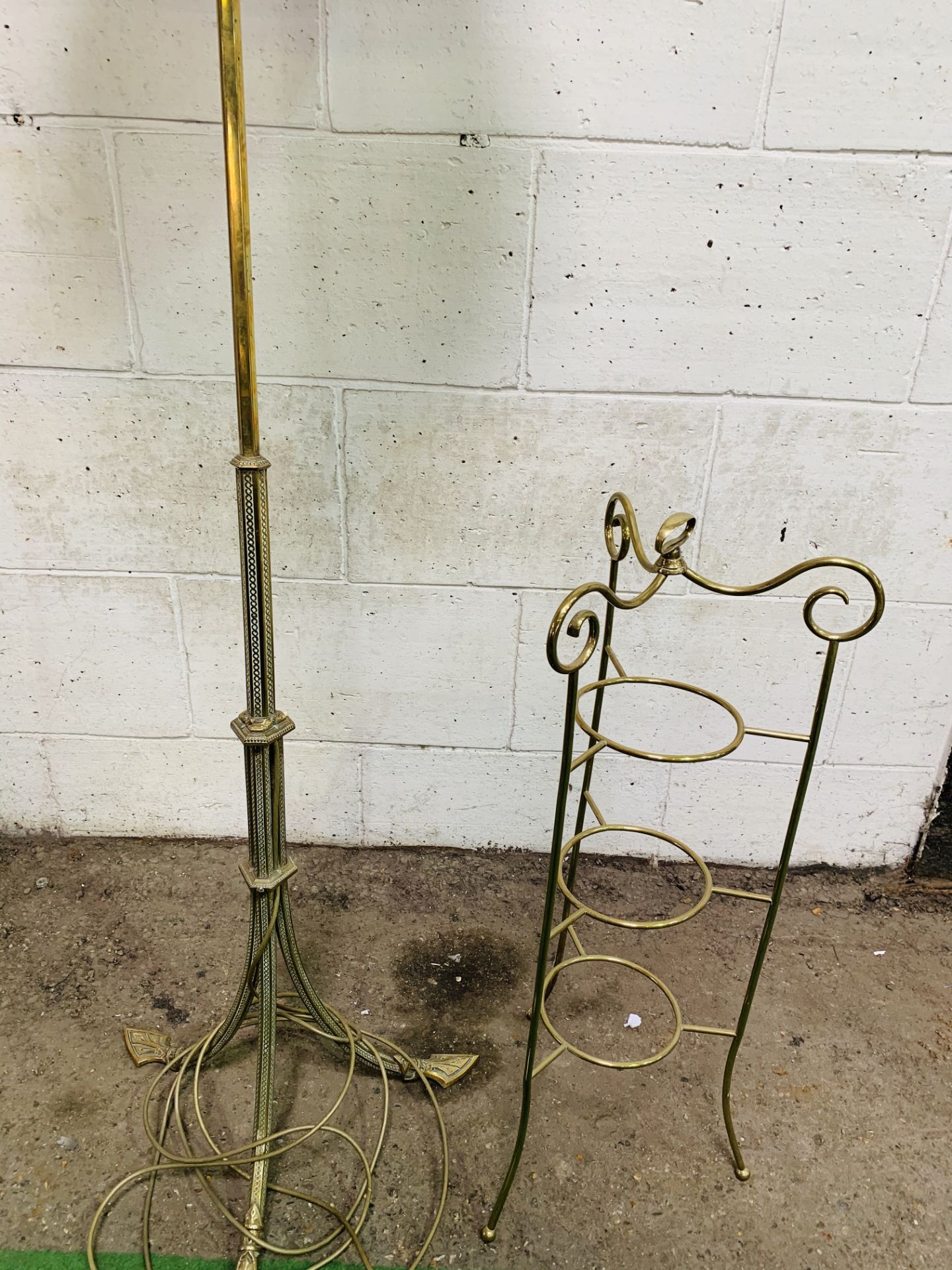 Decorative brass lamp standard to 3 feet, height 140cms; together with a brass 3 tier cake stand.