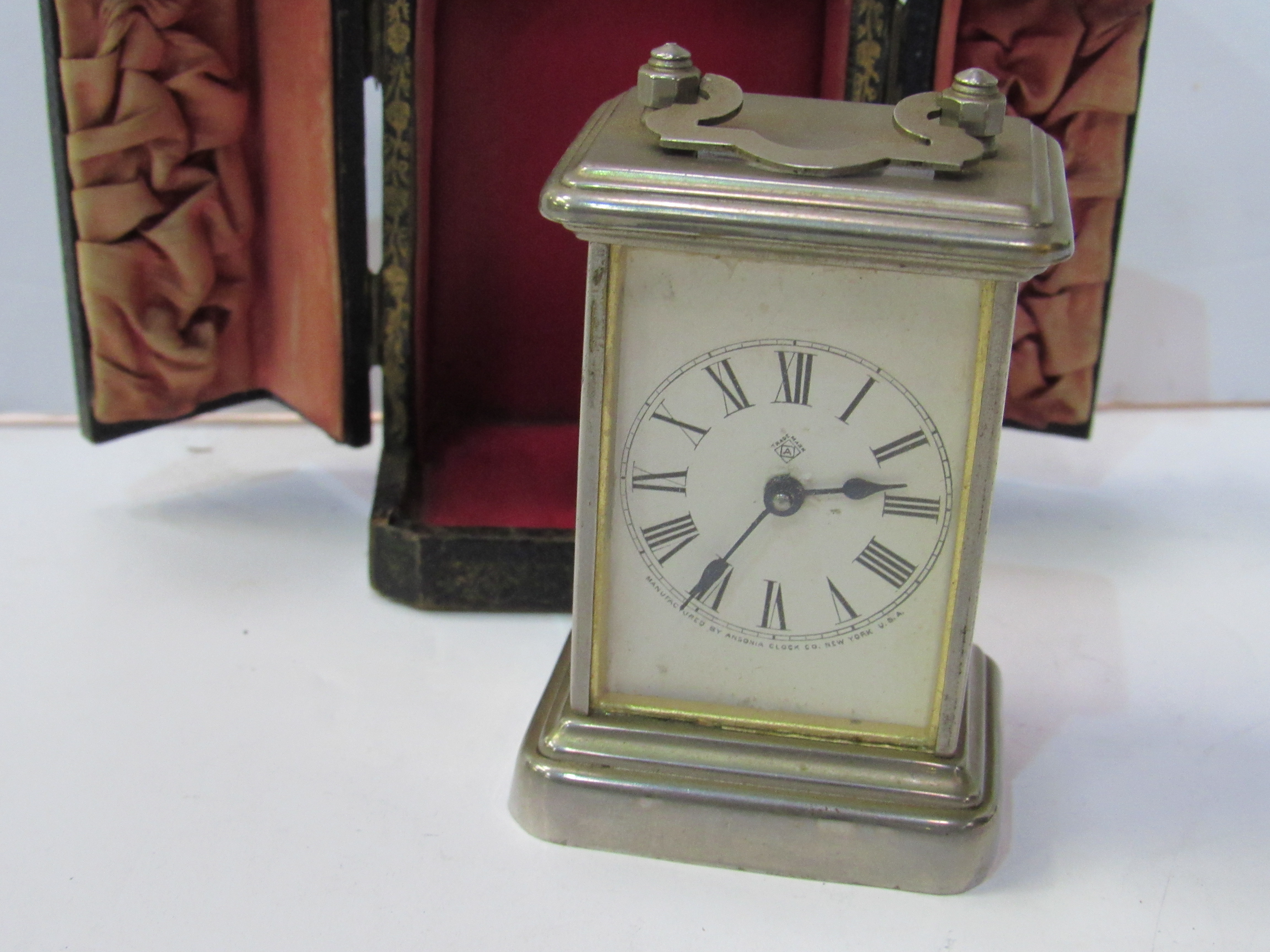 Miniature silver cased carriage clock by Ansonia Clock Co. New York in original leather-covered case