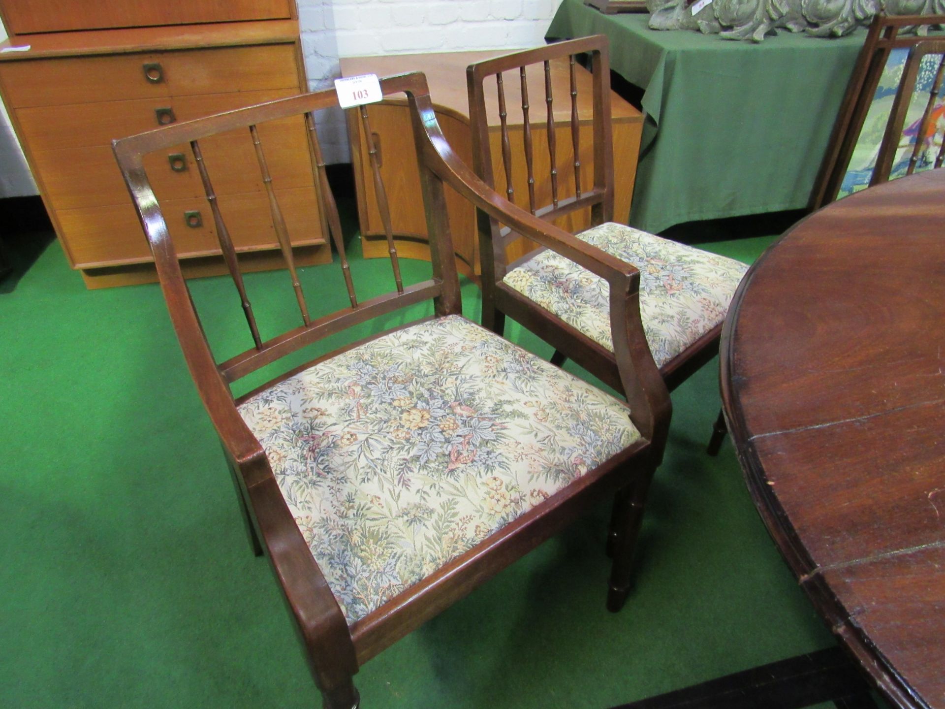 5 spindle back chairs and a matching carver.