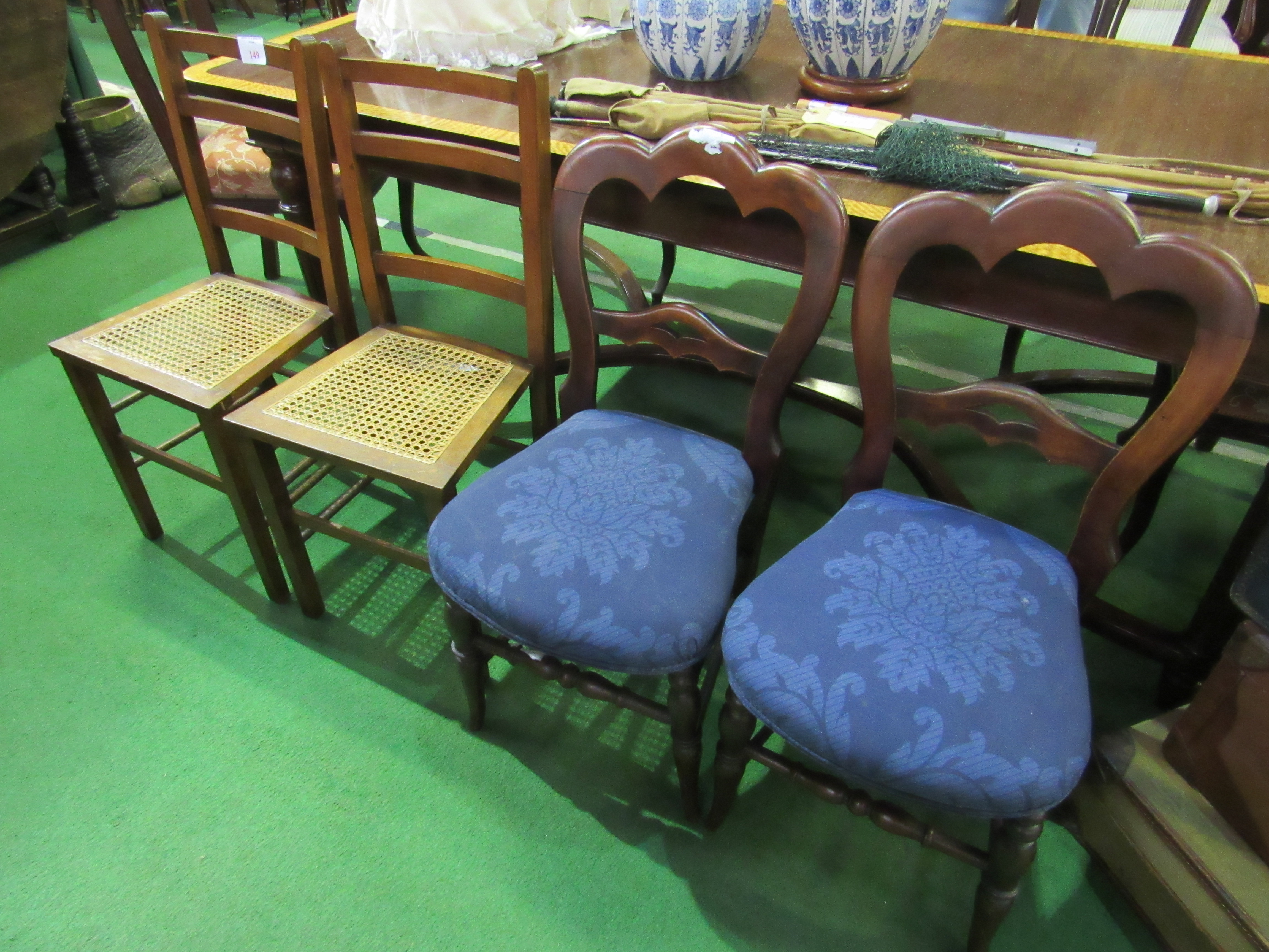 2 cane seat chairs and 2 mahogany framed dining chairs.