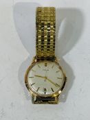 Avia 9ct gold cased manual wind wrist watch, 35 mm dial with date aperture, on rolled gold expandabl