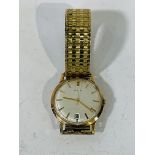 Avia 9ct gold cased manual wind wrist watch, 35 mm dial with date aperture, on rolled gold expandabl