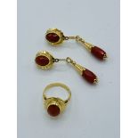 750 gold ring with chequerboard cut dark coral stone, with matching earrings