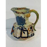 Colourful Davenport Stone China jug with serpent handle, together with a blue and white "mask" jug.