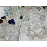 A large qty of glass objects including: candle holders; ashtrays; lidded pots; scent bottles; pair o