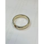 White metal ring set with a small clear stone Wt 4.2gms, size N.