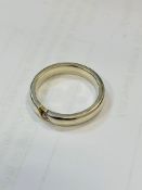 White metal ring set with a small clear stone Wt 4.2gms, size N.