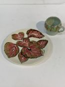 Clarice Cliff plate; red cup; blue and gold decorated plate. With a Portuguese "cabbage leaf" bowl.