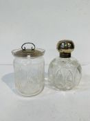Edwardian cut glass scent bottle with silver lid, together with a glass pot with silver lid