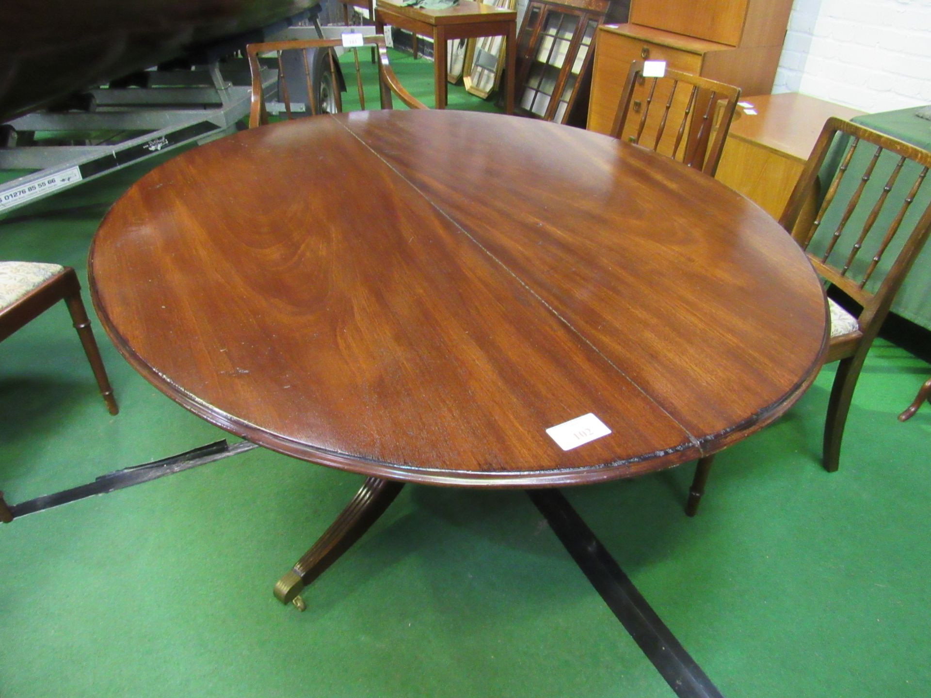 Mahogany oval tilt-top table on heavy pedestal. - Image 3 of 3