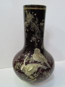 Pair of dark red bottle vases hand-painted with birds and foliage in the style of Thomas Webb