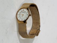 SKAGEN, Denmark, gold plated cocktail watch & band, with mother of pearl face.