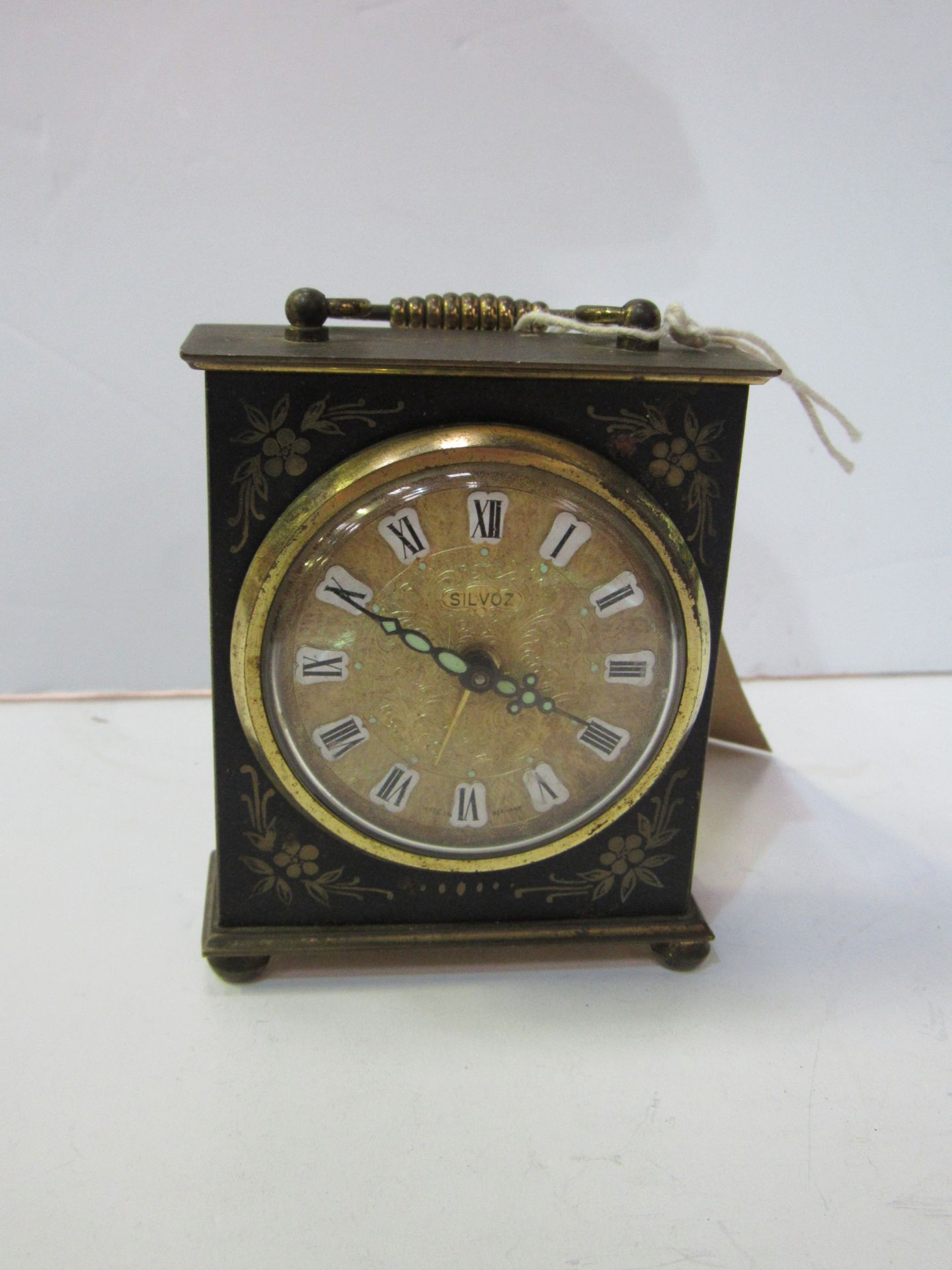 Miniature mantel clock with alarm by Silvoz, Germany.