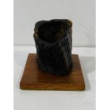 Vintage variegated dark horn quill stand, on wooden base.