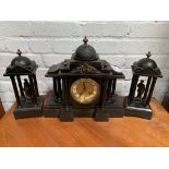 Slate clock set with two figurines garnitures.