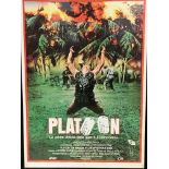 Two framed and glazed film posters, Platoon (1987) and Commando (1985)