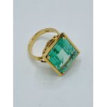 750 gold ring set with large pale green stone