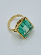 750 gold ring set with large pale green stone