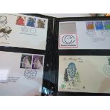 Box of First Day Covers in 3 albums and loose stamps 1960-2006.