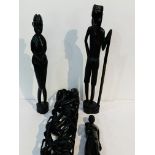 3 carved ethnic figures; a tall ethnic carving of people with sacks; wooden pestle & mortar; and a c
