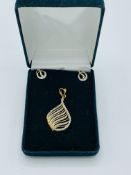 18ct Gold pendant set with diamonds, with matching earrings