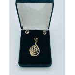 18ct Gold pendant set with diamonds, with matching earrings