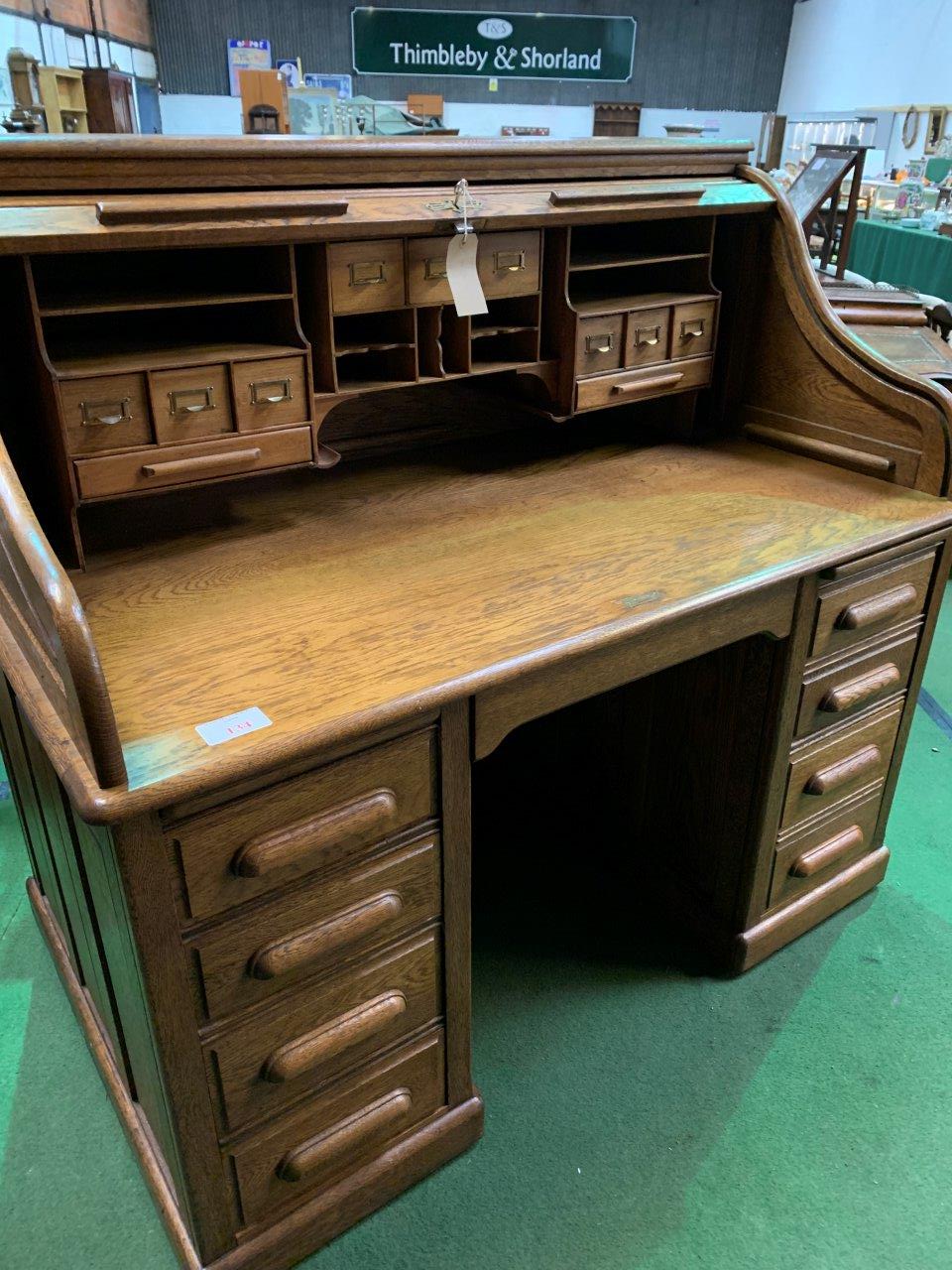 Late 19th Century/early 20th Century oak roll-top top pedestal desk.