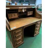 Late 19th Century/early 20th Century oak roll-top top pedestal desk.