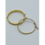 Two 9ct gold bangles with metal cores