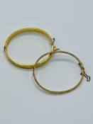 Two 9ct gold bangles with metal cores