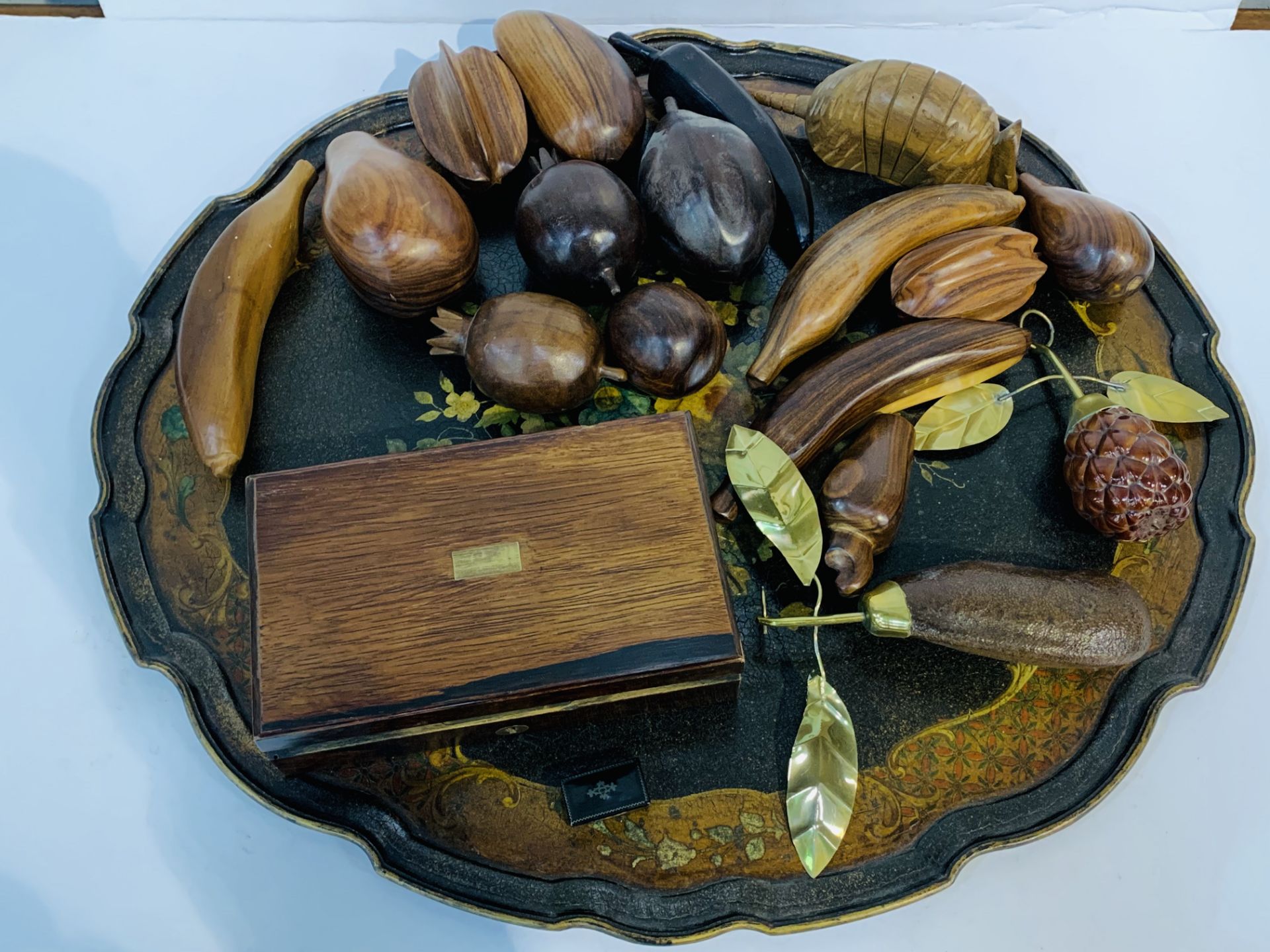 Lacquer tray; qty of polished wood "fruit" ; brass bound wooden box; miniature black wood box.