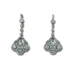 Pair of platinum and diamond drop earrings.