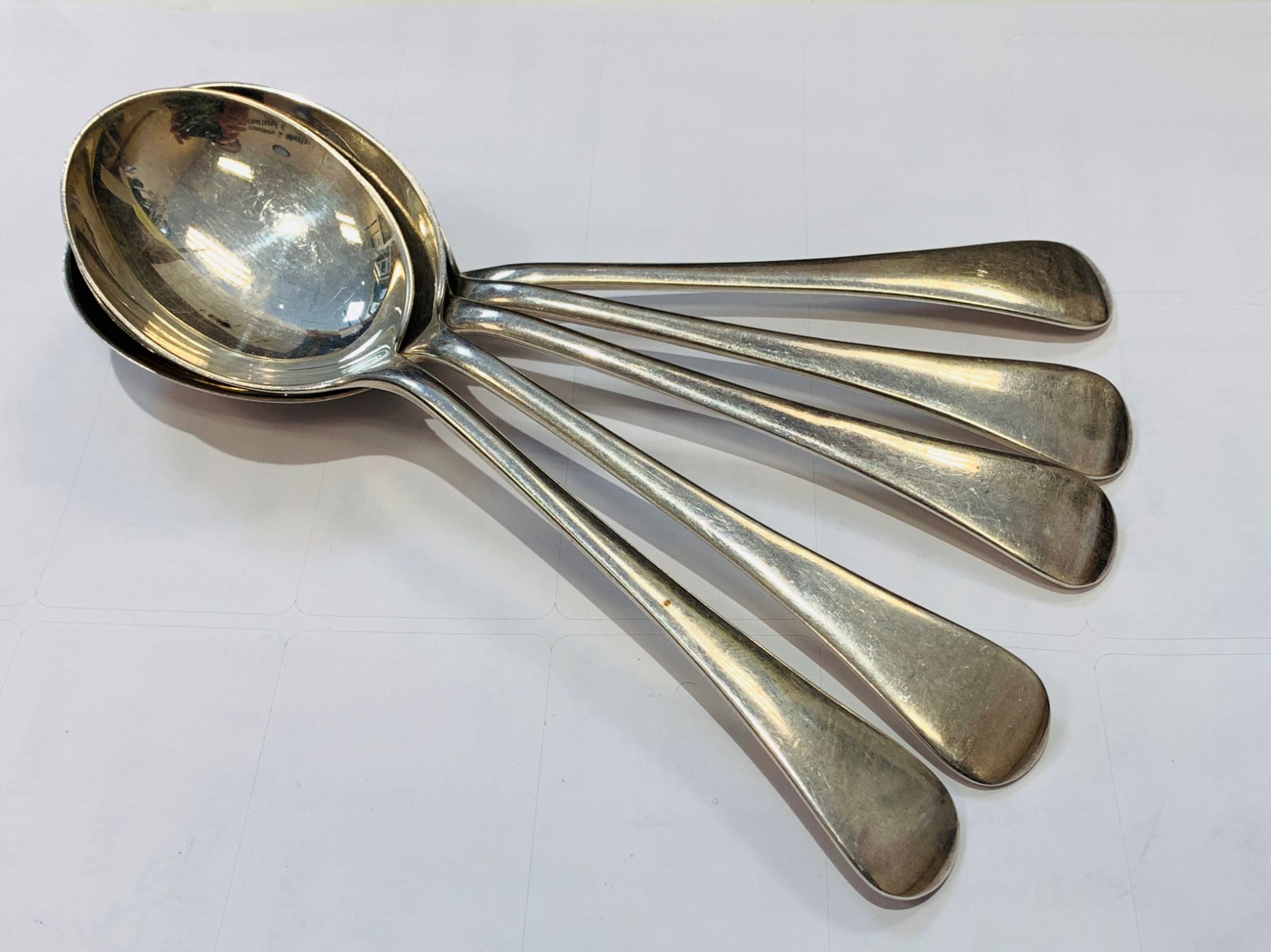 Five silver soup spoons, hallmarked Sheffield 1954. 275gm