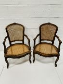 Pair of French style carved mahogany framed bergère open armchairs.